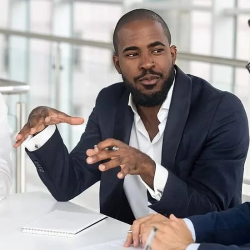 black-businessman-leading-small-group-1
